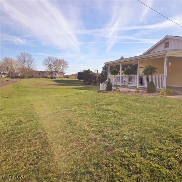 view of yard featuring a porch