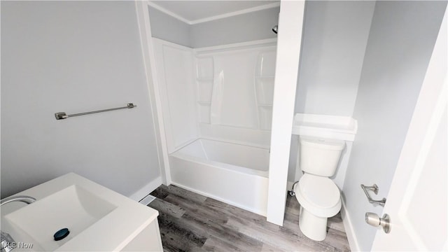 bathroom featuring hardwood / wood-style floors, toilet, and shower / tub combination