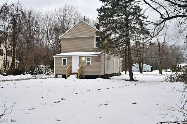 view of snow covered house