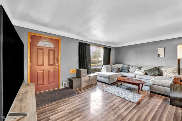 living room with light hardwood / wood-style flooring