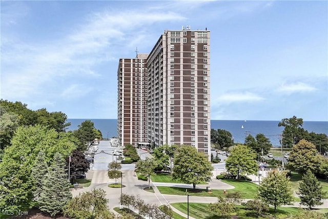 view of building exterior with a water view