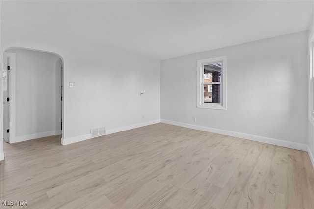 spare room with light hardwood / wood-style flooring