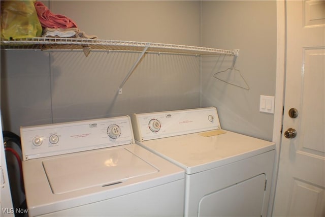 washroom with separate washer and dryer