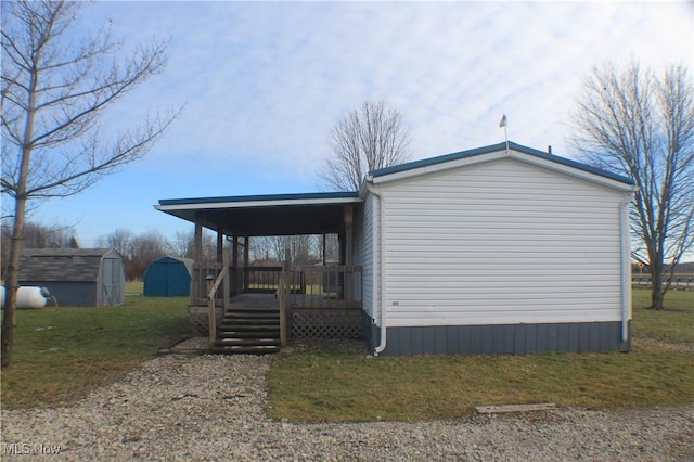 view of home's exterior featuring a yard, a storage shed, and a wooden deck