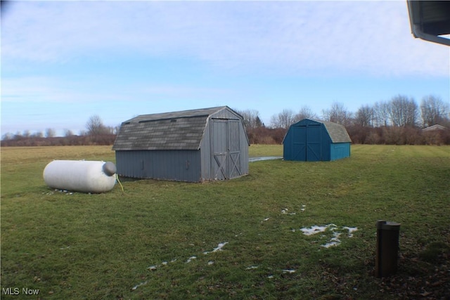 view of outbuilding featuring a lawn