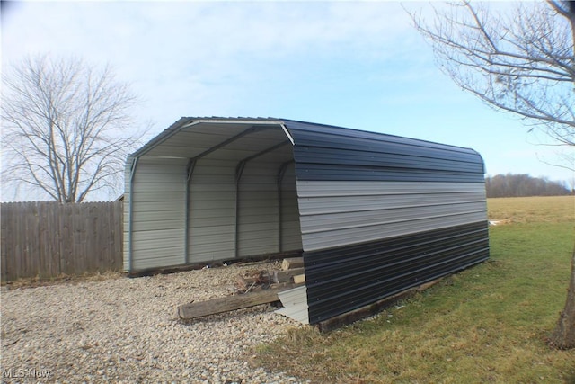 view of outbuilding with a carport