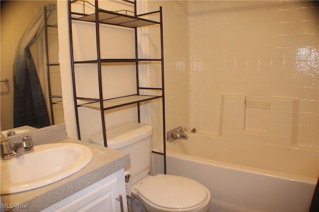 full bathroom featuring vanity, shower / bathtub combination, and toilet