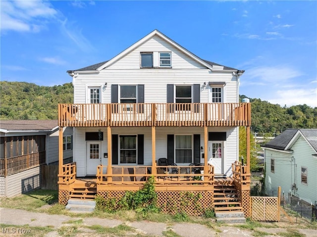 back of house featuring a deck