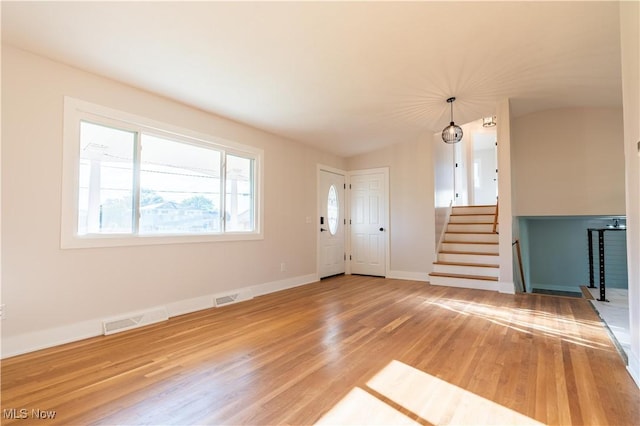 unfurnished living room featuring hardwood / wood-style floors