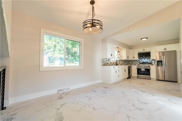 kitchen with white cabinetry, sink, hanging light fixtures, tasteful backsplash, and appliances with stainless steel finishes