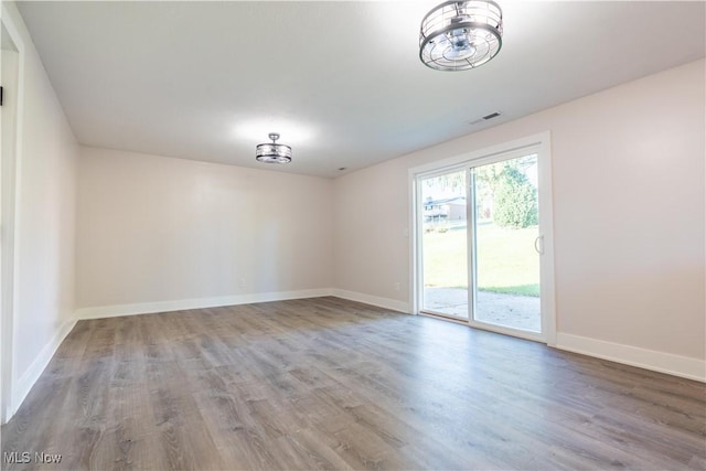 empty room featuring hardwood / wood-style floors