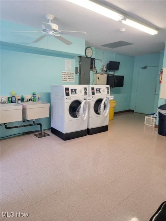 washroom with ceiling fan, sink, and independent washer and dryer