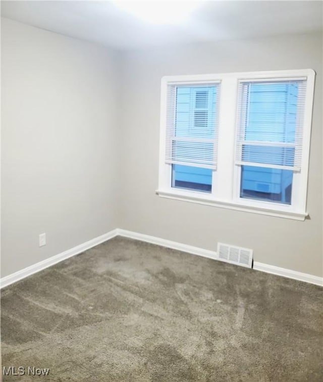 empty room featuring carpet flooring