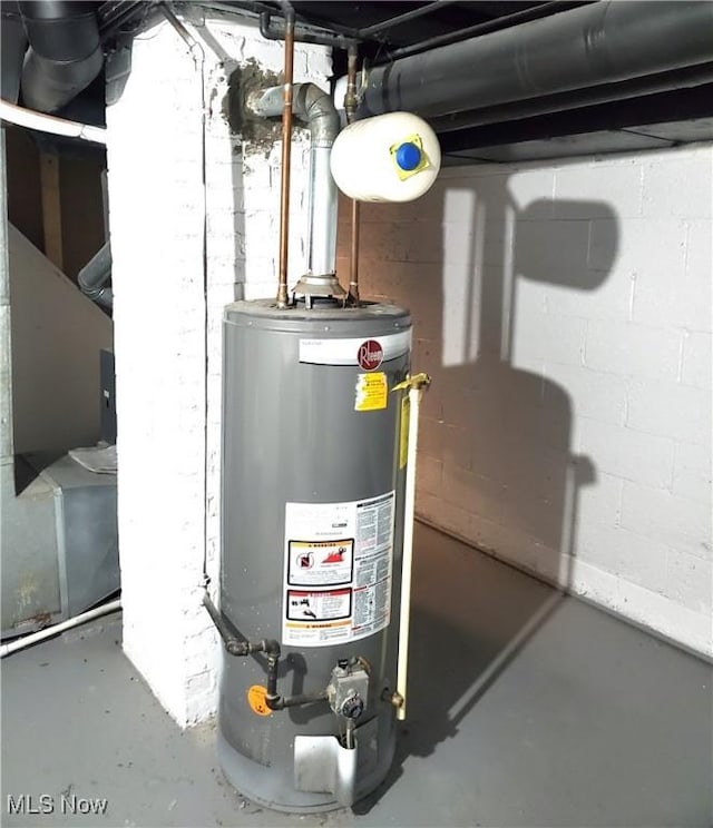 utility room featuring water heater