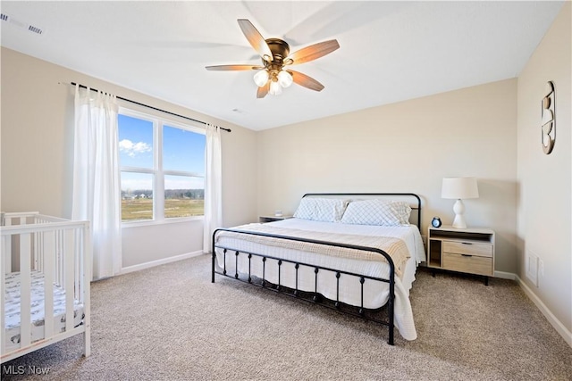 carpeted bedroom featuring ceiling fan