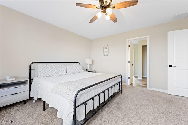 carpeted bedroom featuring ceiling fan