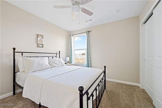 carpeted bedroom with a closet and ceiling fan