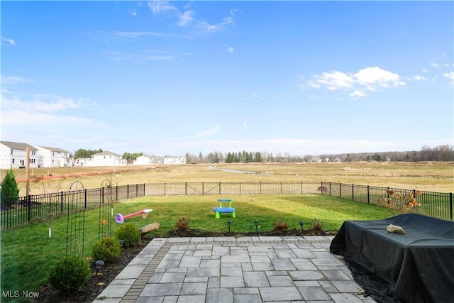 view of patio / terrace featuring area for grilling and a rural view