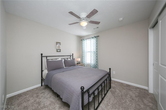 bedroom featuring baseboards, ceiling fan, and light carpet