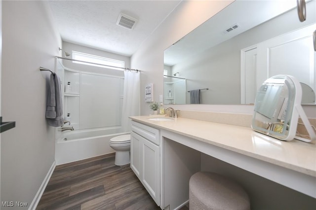 bathroom with shower / bath combo, visible vents, vanity, and wood finished floors