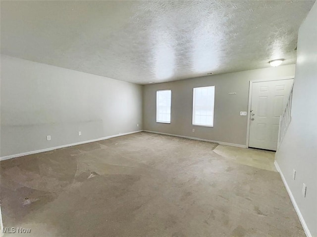 empty room featuring a textured ceiling