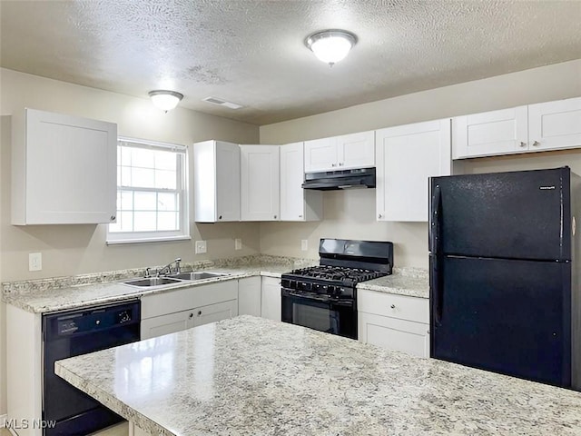 kitchen featuring black appliances, white cabinets, sink, and a textured ceiling