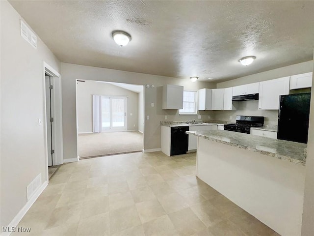 kitchen featuring light stone countertops, a textured ceiling, sink, black appliances, and white cabinets