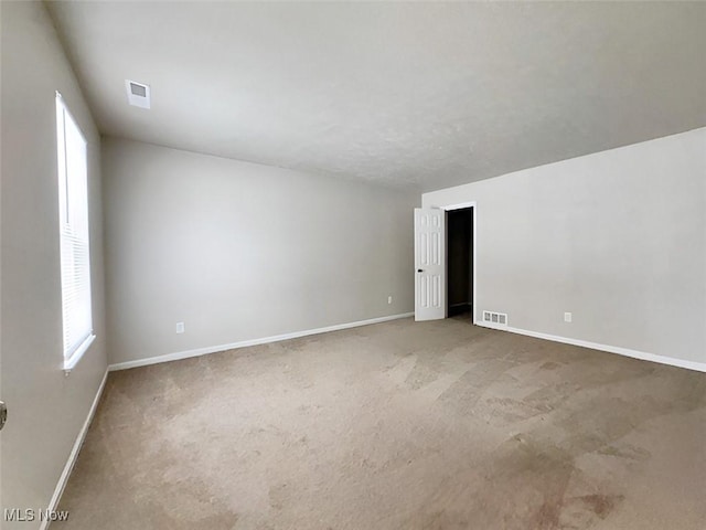 spare room with carpet floors