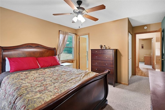 carpeted bedroom with ceiling fan