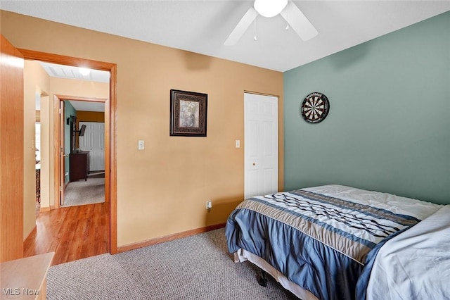 bedroom featuring light carpet and ceiling fan