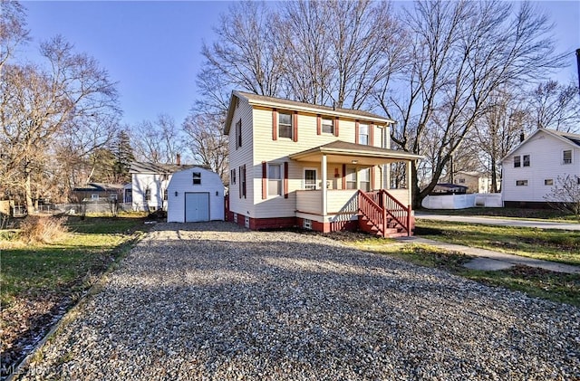 view of front facade with covered porch and a shed