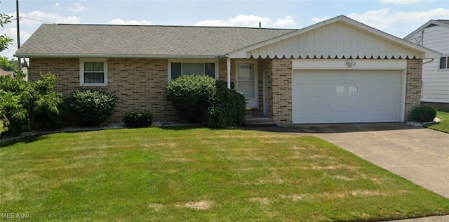 ranch-style home featuring a garage and a front yard