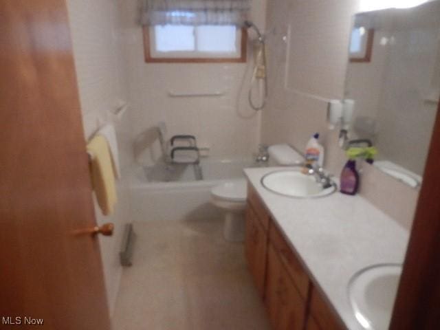 full bathroom with shower / bathing tub combination, vanity, and toilet