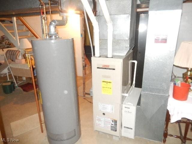 utility room featuring gas water heater