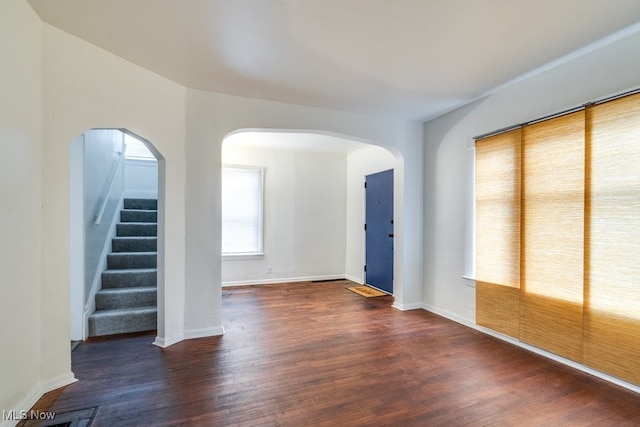 unfurnished room featuring dark hardwood / wood-style floors