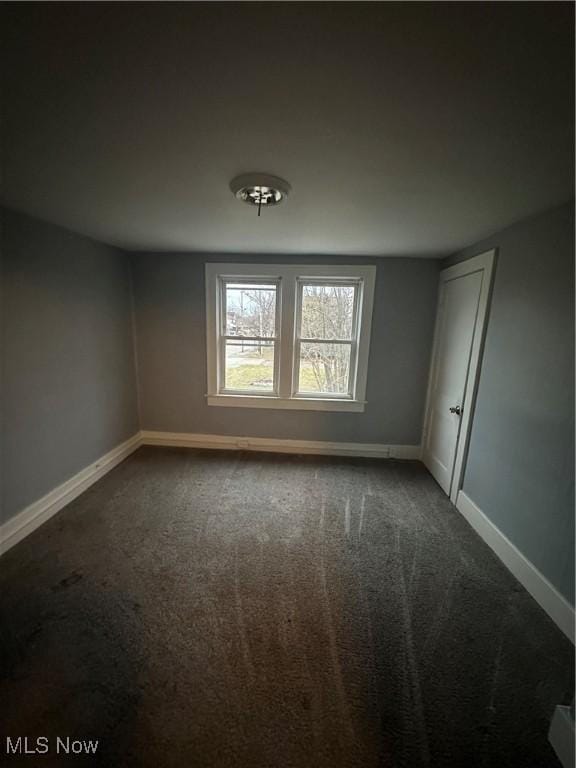 unfurnished room with carpet flooring