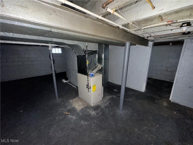 basement featuring heating unit