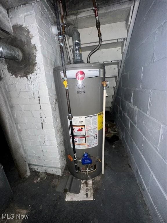 utility room featuring water heater