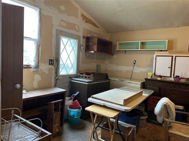 kitchen featuring plenty of natural light and lofted ceiling