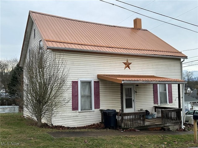 back of house featuring covered porch