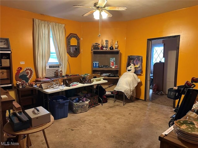 miscellaneous room featuring cooling unit, ceiling fan, and carpet