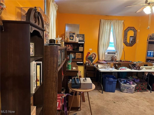 misc room featuring carpet, ceiling fan, and cooling unit