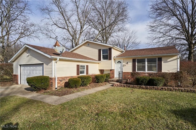 tri-level home featuring a garage and a front lawn