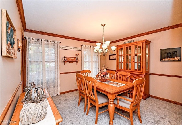 carpeted dining area featuring crown molding and a notable chandelier