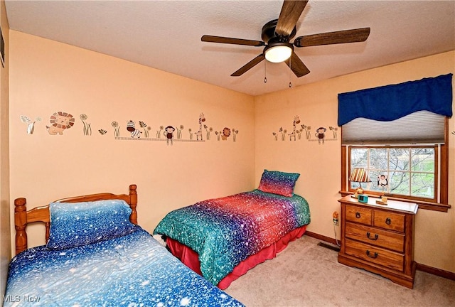 bedroom featuring ceiling fan and carpet floors