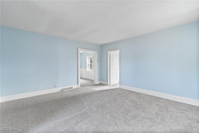 empty room with carpet flooring