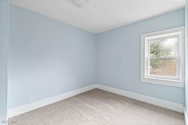 empty room with carpet flooring