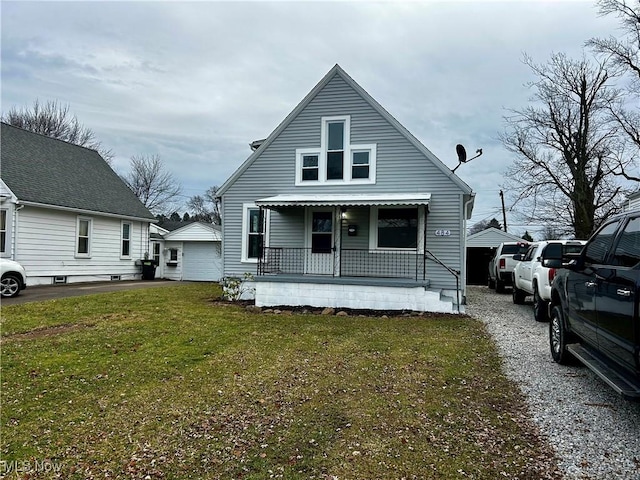 bungalow-style house featuring a porch and a front yard