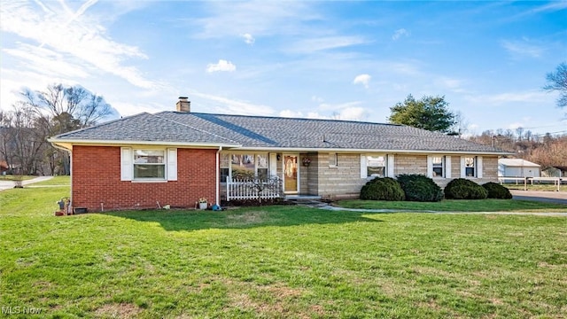 ranch-style home with a front lawn