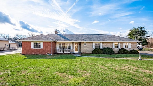 ranch-style house with a porch and a front lawn